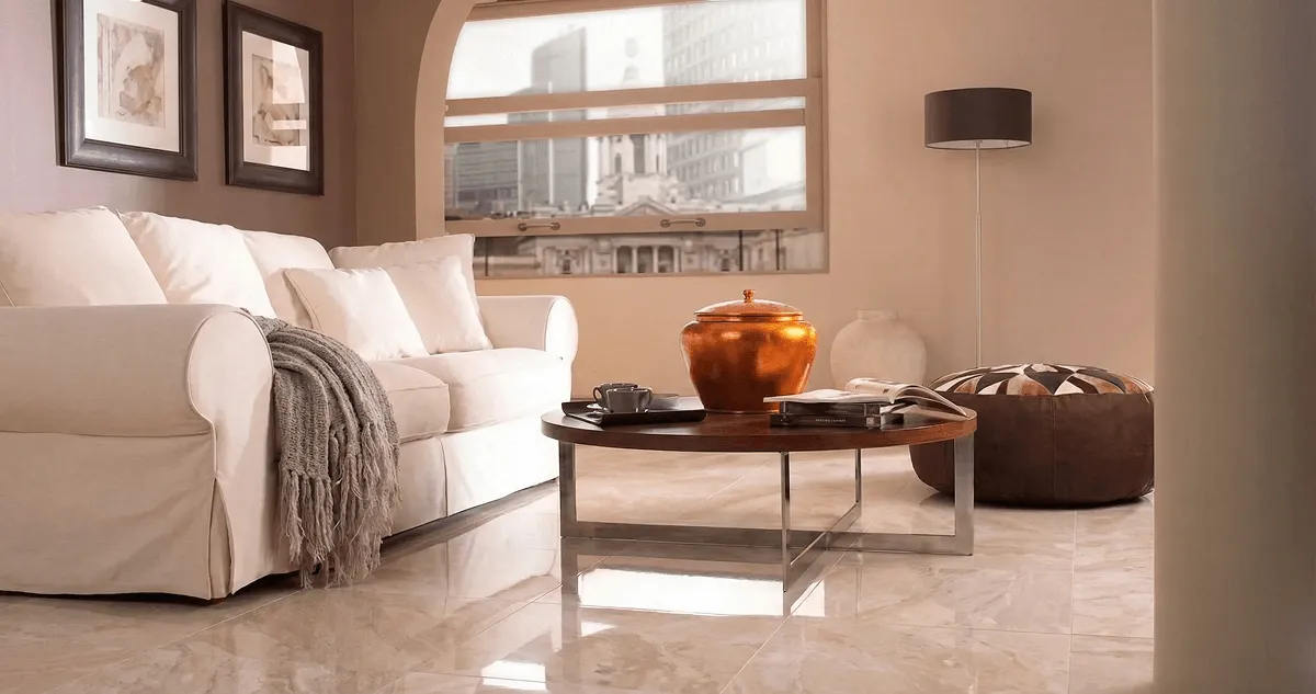 Modern living room with professionally installed marble flooring, a beige sofa, coffee table in Sarasota, FL