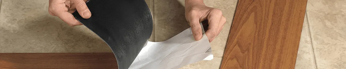 A professional installing vinyl flooring in Sarasota, FL